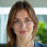 Portrait of Elara Vance, Product Development Lead, with thoughtful expression.
